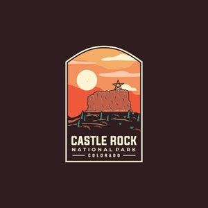May include: A vintage-style illustration of Castle Rock National Park in Colorado. The image features a red rock formation with a star on top, set against a sunset sky with clouds. The text "Castle Rock National Park Colorado" is displayed below the image.