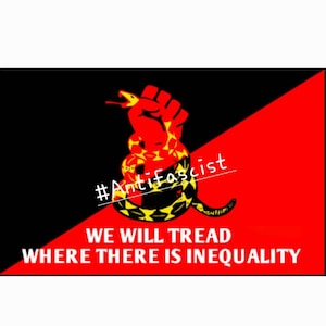 May include: A black and red flag with a yellow and black snake wrapped around a red fist. The flag has the text "#Anti-Fascist" and "WE WILL TREAD WHERE THERE IS INEQUALITY" on it.
