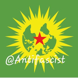 May include: A green flag with a yellow sunburst and a red star on a green globe in the center. The text "@Antifafascist" is written in white at the bottom of the flag.