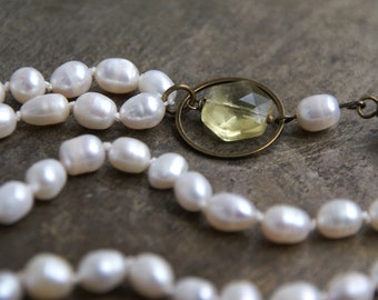 Winter light, necklace with freshwater pearls on silk, faceted lemon quartz and bronze clasp, hand-knotted on silk