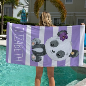 May include: Purple and white striped beach towel with a cute panda bear design and the name "Elizabeth" printed on the side.