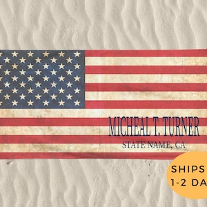 May include: A beach towel with a vintage American flag design. The towel has a personalized name, "MICHEAL T. TURNER", and a state name, "STATE NAME, CA".