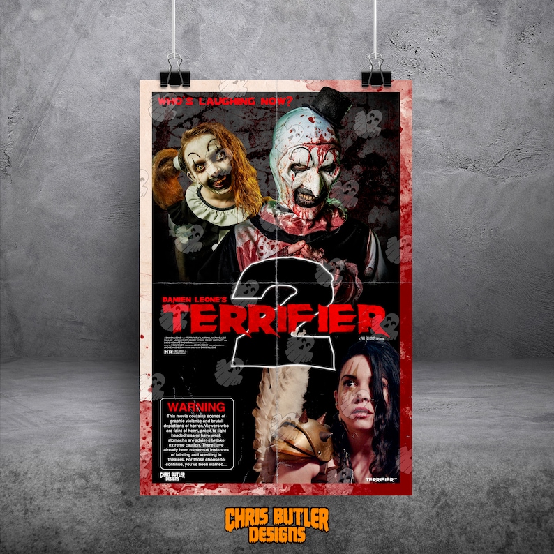 May include: A movie poster for the horror film "Terrifier 2" featuring a clown with a bloody face and a woman with long black hair. The poster has a red and black color scheme and includes the text "Damien Leone's Terrifier 2" and "Warning: This movie contains scenes of graphic violence and brutal depictions of horror. Viewers who are sensitive to graphic content, headaches, and/or those who are easily frightened should take caution. There are numerous instances of blood, gore, and disturbing imagery.  You have been warned."