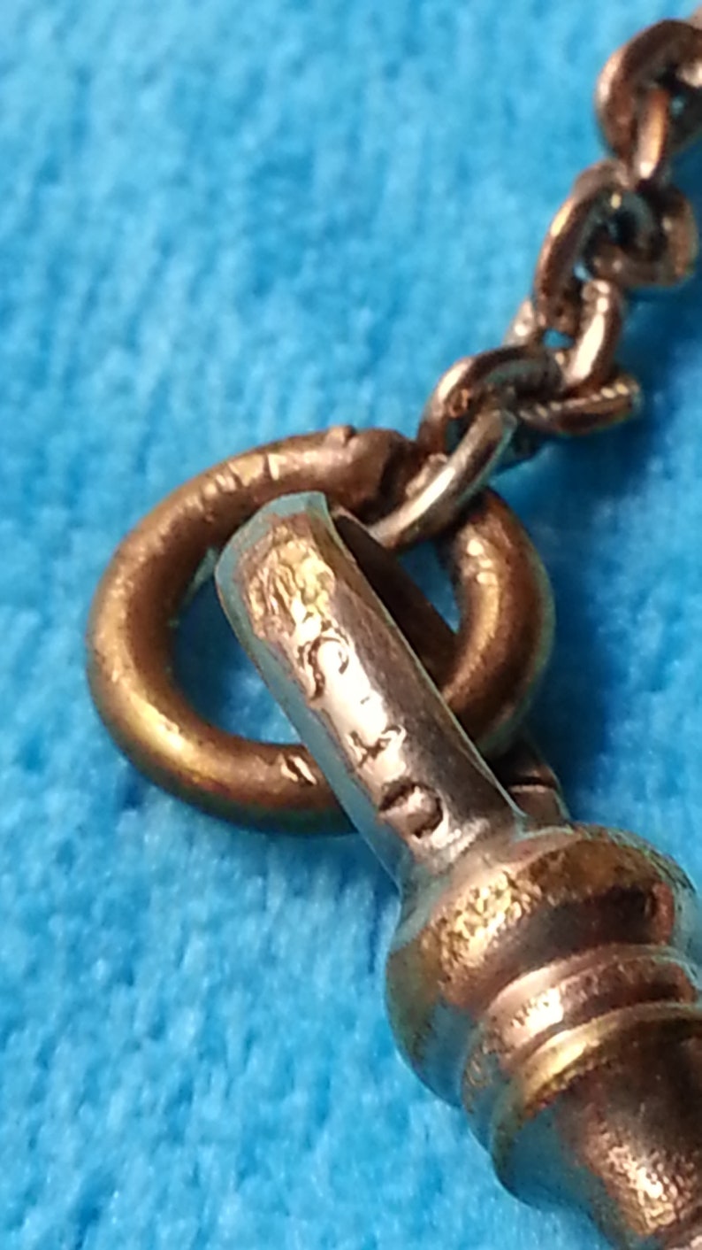 lovely scroll design Beautiful EdwardianArt Nouveau gold-filed locket original chain genuine garnets few scratches good condition