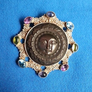 Intricate Sajen sterling silver brooch pendant moon or sun face, rainbow obsidian, blue topaz amethyst, peridot, retired design, collectible