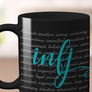 May include: Black coffee mug with a white text description of the personality type "INFJ" in teal blue lettering. The text describes the personality type as "Advocate, sensitive, caring, nurturing, conscientious, committed, persistent, in compassionate, holistic, creative, visionary, sympathetic, complex, growth-oriented, empathetic, independent, sensitive, idealistic, abstract, gentle, future-focused, peace intuitive, organized, passionate, values intense, loyal, private, reserved, assertive, insistent, organized, decisive, deep, insightful, visionary, intuitive, introverted, quiet."