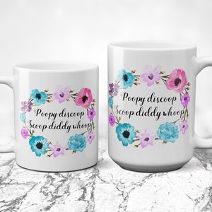 May include: Two white ceramic mugs with a floral design and the text "Poopy discoop Scoop diddy whoop!" in black script.