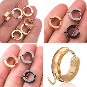 May include: A white ceramic mug with a black handle and the text "But First, Coffee" in a bold, black font. The mug is on a wooden surface. The mug is approximately 10 cm tall.