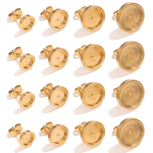 May include: A collection of gold-colored stud earrings with a flat, circular design. The earrings have a post and butterfly backing. The earrings are arranged in rows and columns, with a bright, reflective surface.