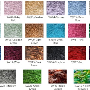May include: A grid of twenty-two rectangular swatches displaying various colors and marbled textures. Each swatch is labeled with a code and color name, including White, Baby Pink, Golden, Mauve, Metal Blue, Silver Grey, Water Blue, Celadon Green, Light Brown, Cyan Blue, Pink, Emerald Green, Ocean Blue, Wine, Dark Brown, Graphite, Red, Violet, Titanium, Grass Green, Beige Copper, and Yellow Seaweed.