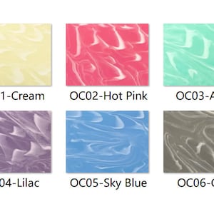 Puede incluir: Seis muestras de color que muestran diferentes tonos de crema, rosa intenso, aguamarina, lila, azul cielo y gris. Cada muestra tiene un patrón de remolino marmoleado.