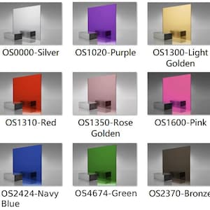Può includere: Una collezione di lastre acriliche colorate, ciascuna esposta su un piccolo blocco argentato. I colori includono argento, viola, oro chiaro, rosso, oro rosa, rosa, blu navy, verde e bronzo. Ogni lastra ha un codice prodotto.