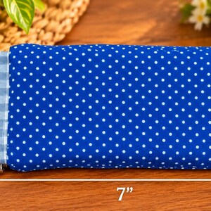 May include: A rectangular fabric pouch featuring a royal blue exterior with a white polka dot pattern and a light blue and white gingham check side panel. The pouch measures 3.5 inches in height and 7 inches in length as indicated by arrows.