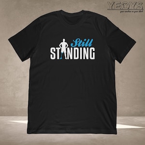 Still Standing T-Shirt | Amputation gift for veteran & disabled person | Unisex Tee, Tank Top, Hoodie