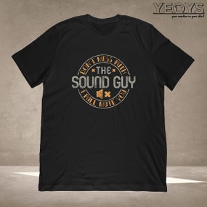 May include: Black t-shirt with a distressed orange circle graphic that says "Don't mess with *the* Sound Guy I will mute you" with a speaker icon.