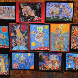 May include: A set of 10 colorful postcards featuring whimsical animal illustrations. Each card features a different animal, such as a rhino, a cat, a cow, and a sun, with intricate details and vibrant colors. The cards are perfect for sending a unique and personal message.