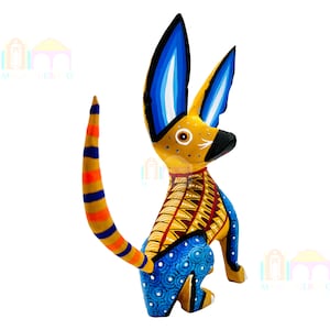 May include: A hand-painted wooden dog figurine with blue, yellow, and orange colors. The dog has large ears and a long tail.