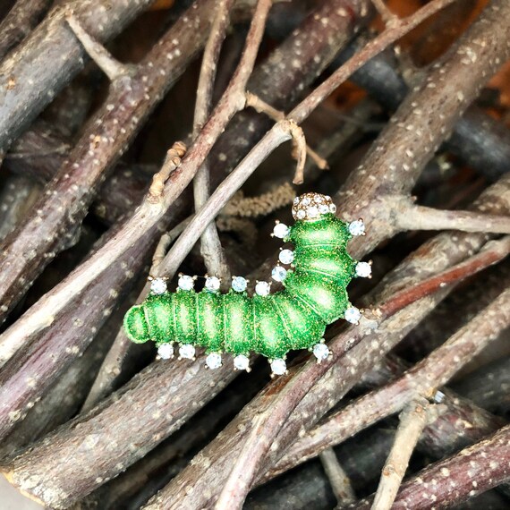 Caterpillar brooch deals