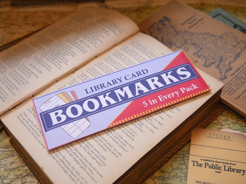 May include: A blue and red bookmark pack with the text "LIBRARY CARD BOOKMARKS 5 in Every Pack".