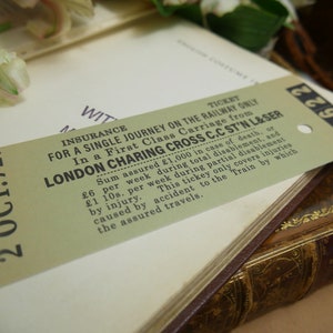 May include: A vintage insurance ticket for a single journey on the railway from London Charing Cross to C.C. ST'N L&SER. The ticket is dated 2 Oct. 72. The ticket is printed on a light brown paper with black text. The ticket is for a first-class carriage and includes insurance for death or total disablement.