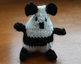 Hand-knit stuffed panda bear.