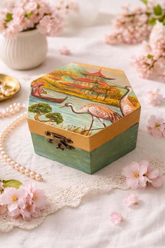Hexagon wooden box with Asian crane decoupage — a genuinely striking visual that doubles as a keepsake with real craft technique behind it.