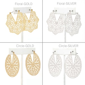 May include: Four pairs of earrings in gold and silver. Two pairs are floral designs, and two are oval circle designs. The text "Floral-GOLD", "Floral-SILVER", "Circle-GOLD", and "Circle-SILVER" are displayed above each pair of earrings.