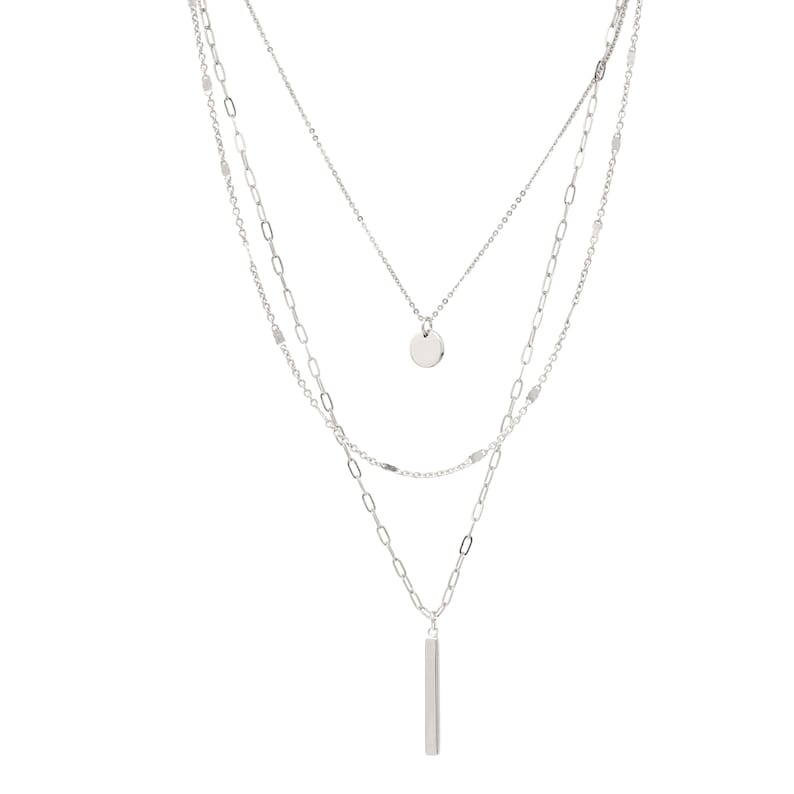 A set of 3 layered necklace in silver with a small disc and a skinny bar charms.
