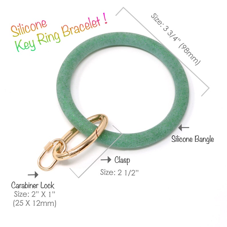 May include: Green silicone key ring bracelet with a gold clasp and carabiner lock. The bracelet measures 3 3/4 inches in diameter and the clasp measures 2 1/2 inches.