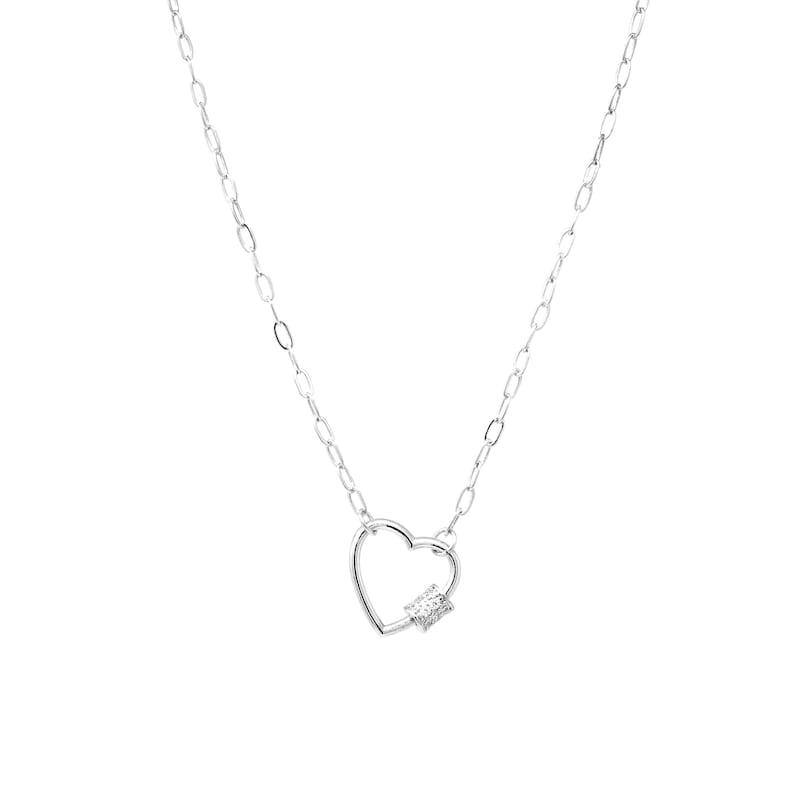 May include: A silver chain necklace with a heart-shaped pendant featuring a small, clear crystal.