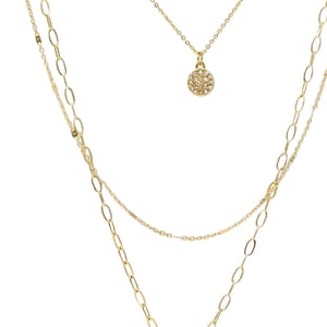 A three-layered gold necklace featuring a script initial charm and a small circle charm paved with stones.