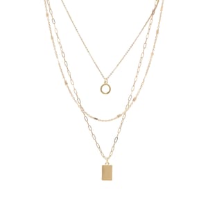 May include: A gold layered necklace with a circle pendant and a rectangular pendant.