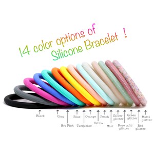 May include: 14 silicone bracelet options in various colors, including black, gray, blue, hot pink, turquoise, orange, peach, yellow, mint, silver glitter, green glitter, rose gold glitter, red glitter, and multi glitter.