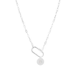 May include: Silver chain necklace with a silver carabiner clasp and a silver disc charm with the letter 'B' engraved on it.