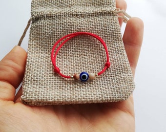 Pulsera de bebé con protección contra el mal de ojo. Amuleto de hilo rojo para recién nacido. Motivo del ojo de Nazar. Piedra de jaspe. Hilo rojo y oro macizo de 14k para niño pequeño