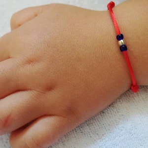 Red baby bracelet. Solid gold bracelet for newborn. Evil eye protection for toddlers. Red string of fate. Kabbalah Lucky string for children