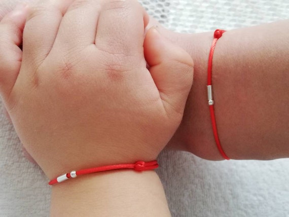 Red bracelet for best sale newborn