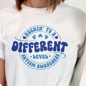 Autism Awareness Rockin&#39; To A Different Level T-Shirt, Unisex Tee for Autism Support, Inspirational Autism Advocacy T-Shirt