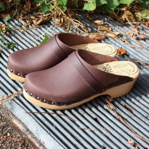 Women clogs in natural greased leather with decorative nails