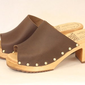High heel slip-in clogs in natural greased leather with decorative nails