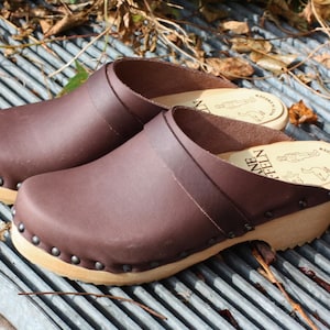Men clogs in natural greased leather with decorative nails