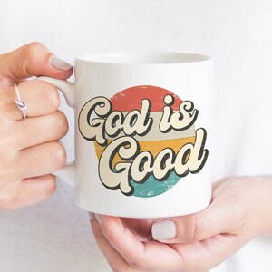 May include: White ceramic mug with a red, orange, yellow, and blue retro-style graphic that says "God is Good".