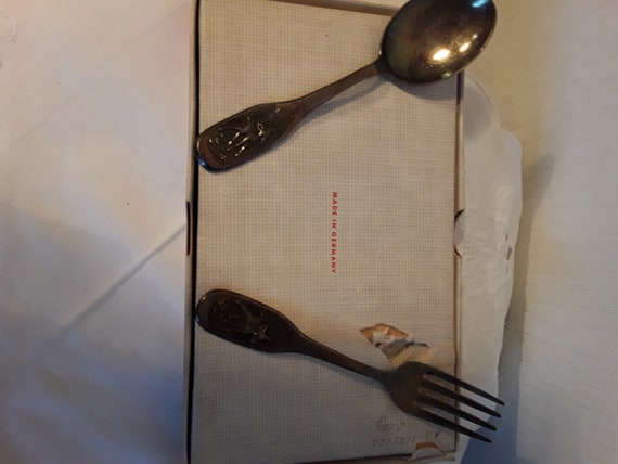 Silver spoon and fork for children