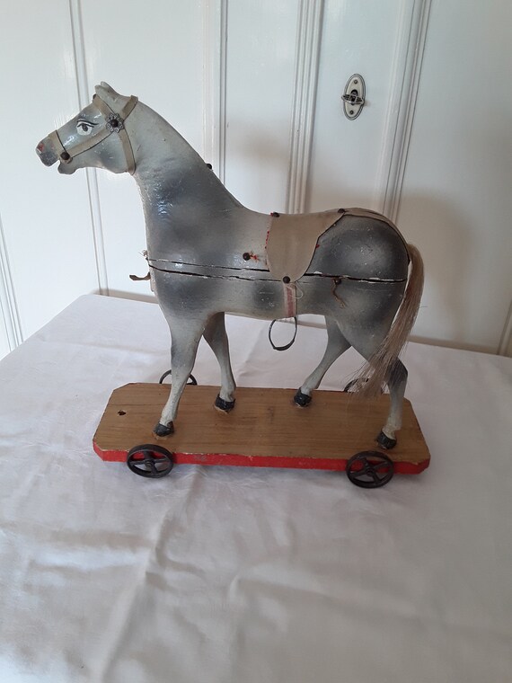antique wooden horse on wheels