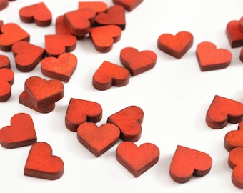 100 Wedding confetti. red wooden confetti. small red hearts. red wedding confetti. wedding decorations and ideas. wedding decorations