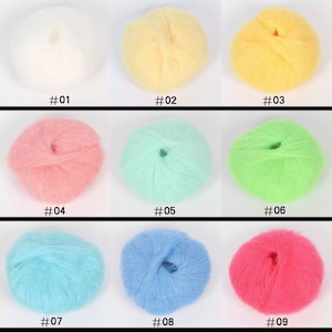 May include: Nine balls of yarn in different colors, including white, yellow, pink, green, blue, and red. Each ball is labeled with a number from 01 to 09.