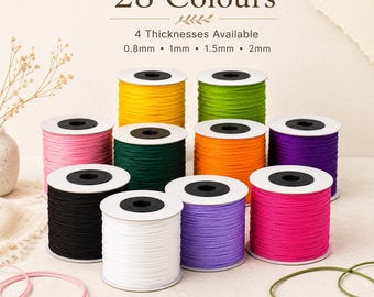 May include: Multiple spools of colorful nylon cord arranged in a group. The text reads 28 Colours and 4 Thicknesses Available 0.8mm, 1mm, 1.5mm, 2mm. The spools feature vibrant shades including yellow, green, pink, dark green, orange, purple, black, white, and magenta.