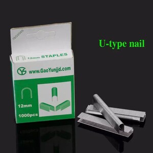 May include: A box of 12mm staples, containing 1000 pieces, with the text "U-type nail". The box is white and green, with the website address www.GaoYunjd.com. Several silver staples are scattered around the box.
