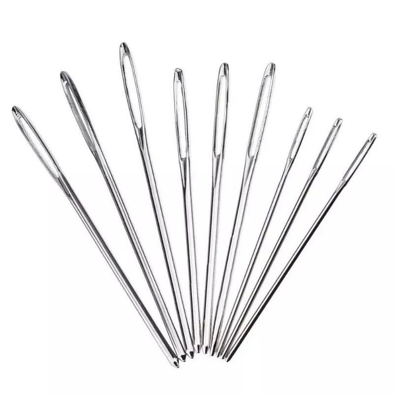 May include: A set of ten silver sewing needles of varying lengths.
