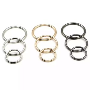May include: Three sets of metal rings in silver, gold, and black. Each set has three rings of different sizes.